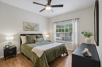 Bedroom with bedding and ceiling fan